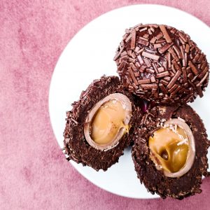 notjustatit easter easter bakes caramel scotch egg on pink velvet background